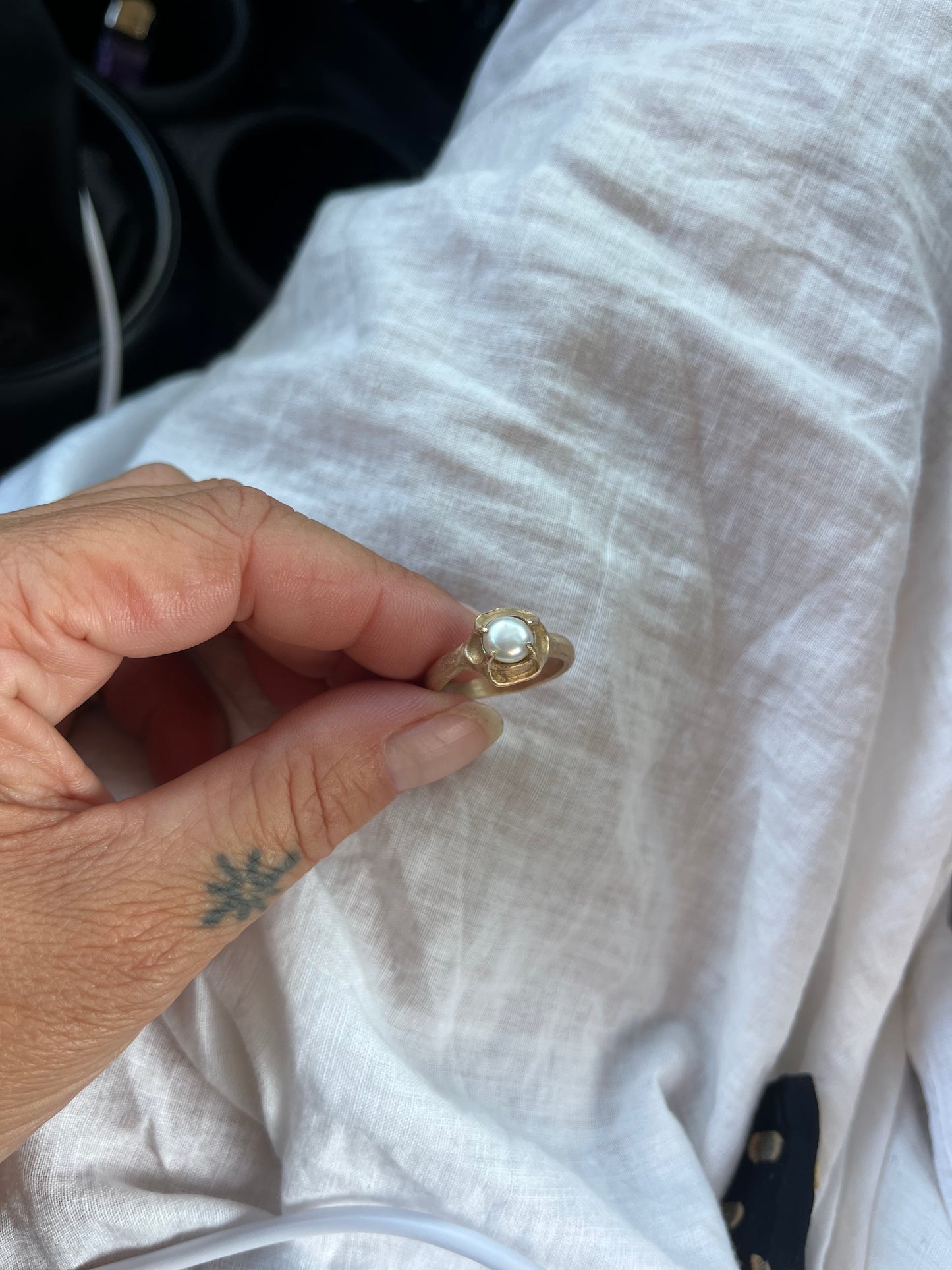 Natural Pearl On Bronze cast band.